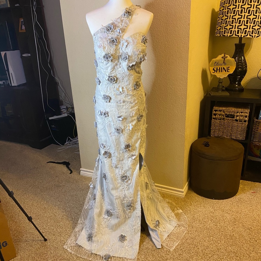 One shoulder gown with detachable train.